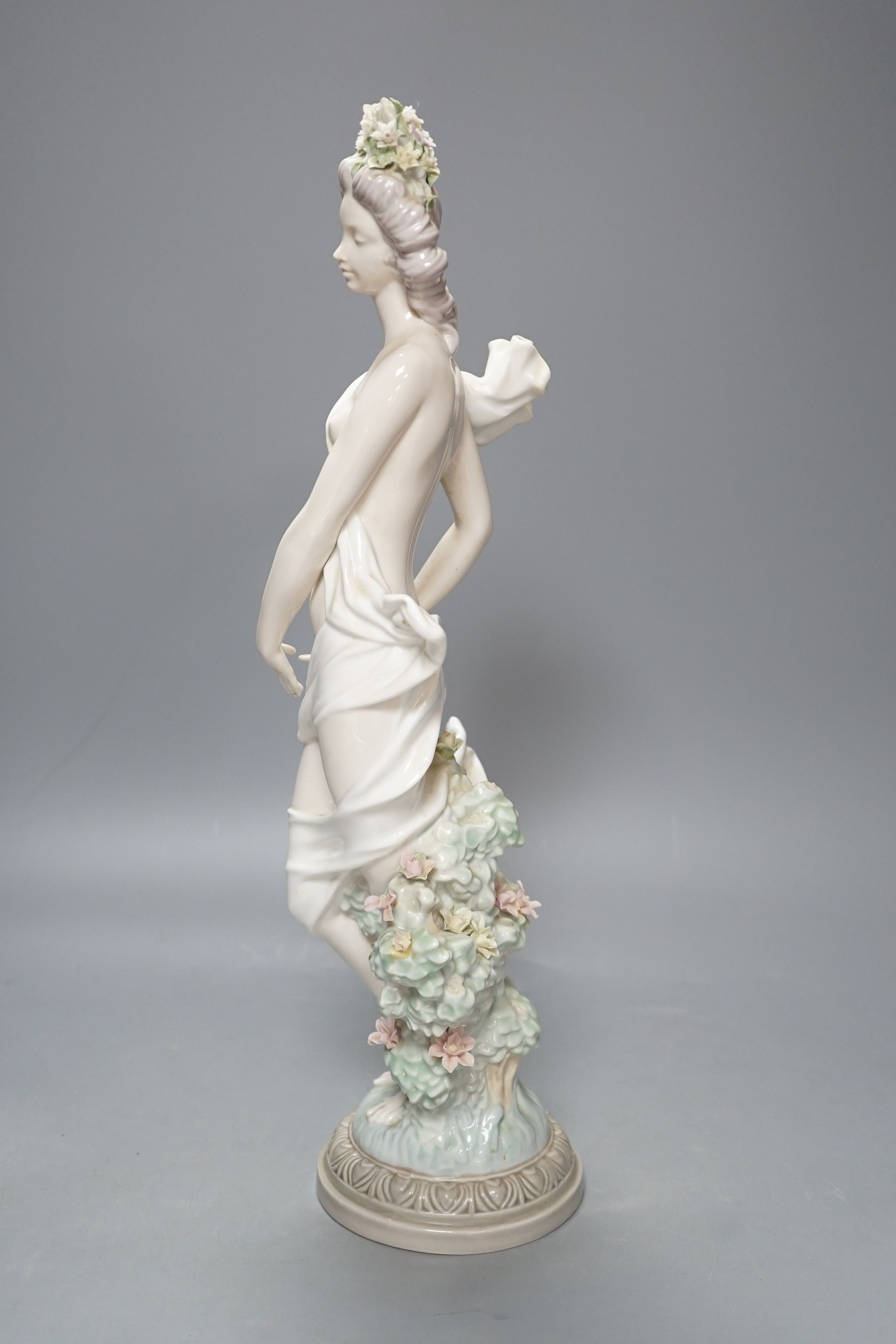 A Lladro female figurine, decorators signature on base, No 401, 41 cms.